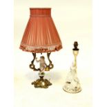 A gilt metal table lamp, the base with porcelain putti,