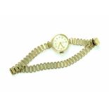 Tudor; a ladies' 9ct gold watch, the white dial set with smaller subsidiary seconds dial, 15 jewels,