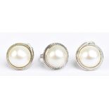 A suite of 14ct white gold and Mabé pearl jewellery comprising a ring, size M 1/2, and a pair of ear