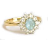 An 18ct yellow gold diamond and blue stone cluster ring, size P, approx 4.9g.Additional