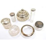 A group of variously hallmarked silver topped and mounted clear glass jars, weighable silver