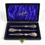 GIBSON & CO LTD; an Edward VII hallmarked silver three piece manicure set, the silver handles with