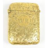A 9ct yellow gold vesta case with engraved initials W.R to a circular cartouche within a floral