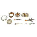 A group of nine Scottish silver brooches, including a Celtic knot, hardstone set pierced example,