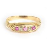 An 18ct yellow gold diamond chip and ruby five stone ring, size L, approx 1.7g.Additional