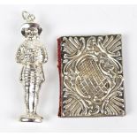 ARTHUR JOHNSON SMITH; an Edward VII hallmarked silver mounted and leather needle case, in the form