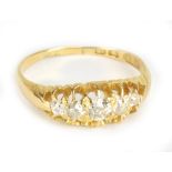An 18ct yellow gold and diamond five stone and graduated ring, the central stone weighing approx 0.