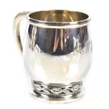 WILLIAM DEVONPORT; a George V Art Deco christening cup with C-scroll handle, engraved initials 'A.