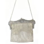 FH ADAMS & CO; an Edward VII hallmarked silver mesh purse, the mount with engine turned