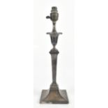 HAWKSWORTH, EYRE & CO LTD; a hallmarked silver converted table lamp, with cast scrolling borders,