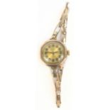ROLEX; a lady's vintage 9ct yellow gold wristwatch, the circular enamel dial set with Arabic