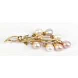 A 9ct yellow gold diamond and pearl spray brooch, length 5.5cm, approx 6.3g.Additional