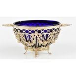 A Swedish 830 grade silver twin handled pedestal bowl with blue glass liner, with cast and pierced