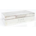 PADGETT & BRAHAM LTD; an Edward VII hallmarked silver cigarette box with engine turned cover,