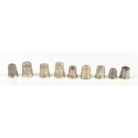 HENRY GRIFFITH & SONS LTD; nine hallmarked silver thimbles including an agate topped example with