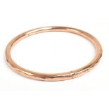 A 9ct yellow gold wax filled bangle, diameter 8.3cm.