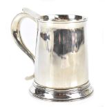 BLACKMORE & FLETCHER LTD; a George V hallmarked silver mug with high loop handle and plain