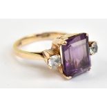 A yellow metal amethyst and white sapphire ring, the inner band stamped 14c, size L, approx 4.4g.