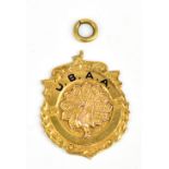 U.B.A.A.; a yellow metal and enamel decorated pendant centered with a peacock and inscribed to the