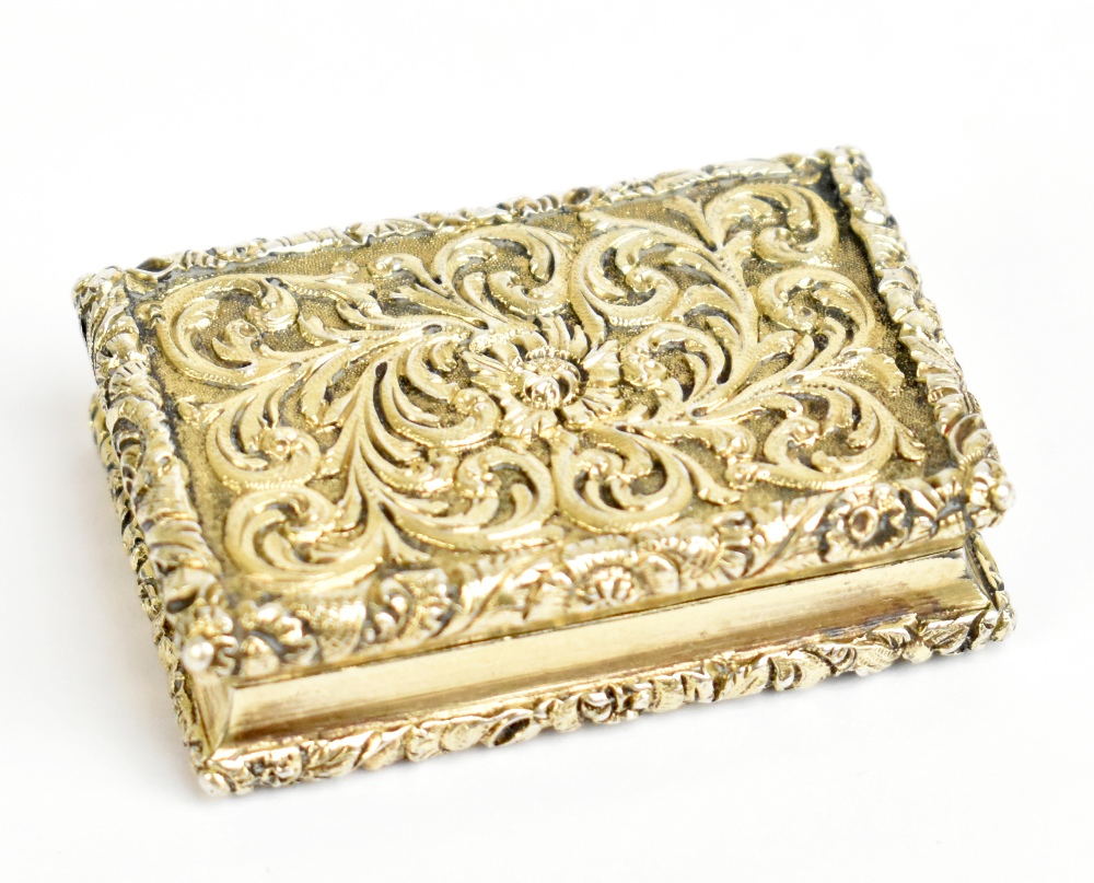NATHANIEL MILLS; a George IV hallmarked silver vinaigrette of rectangular form, with cast floral and