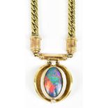 A 9ct yellow gold curb link necklace, with triplet opal flanked by two white stones, approx 25.9g.