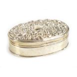 ADIE & LOVEKIN; an Edwardian hallmarked silver trinket box of oval form, the embossed hinged lid