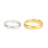 A 22ct yellow gold wedding band, size P 1/2, approx 5.5g, and a silver wedding band, size K (2).