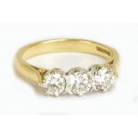 An 18ct yellow gold three stone diamond ring, each brilliant cut stone weighing approx 0.20cts, ring