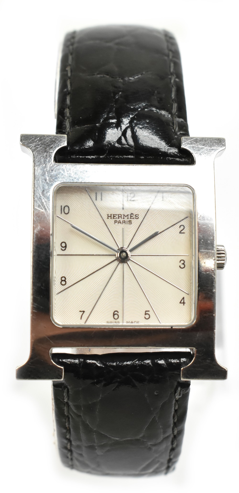 HERMÈS; a stainless steel wristwatch, the rounded square dial set with Arabic numerals within the