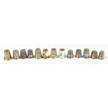Thirteen white metal thimbles including a German sterling silver enamelled example, etc, combined