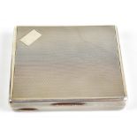 A NICHOLS & SON; a George V hallmarked silver cigarette case of rectangular form with engine