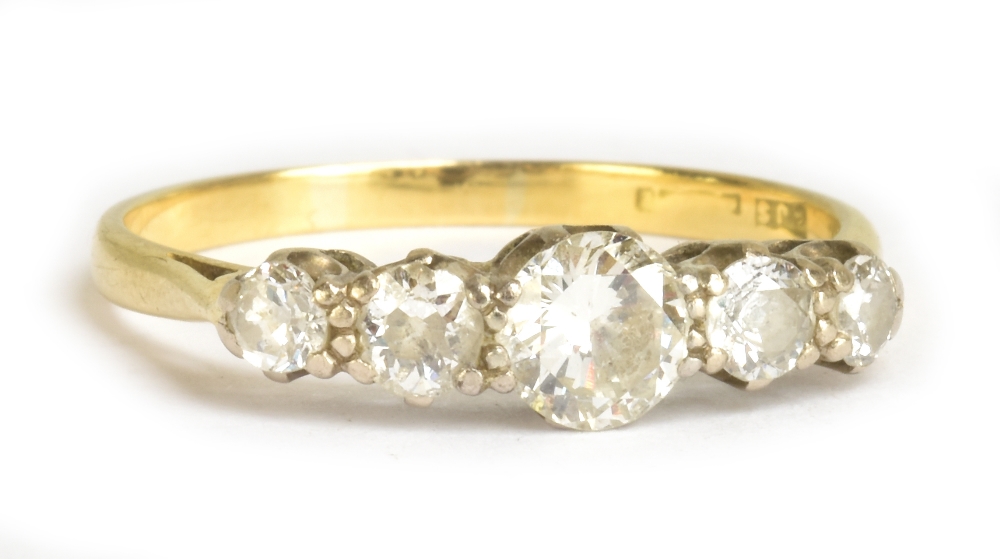 A yellow metal five stone diamond ring, the central diamond weighing 0.50cts, size Q 1/2, approx 2.