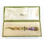 ERIK AUGUST COLLIN (1836-1901); a Russian silver gilt and guilloche enamel letter opener, with