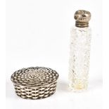 A Continental silver pill box in the form of a woven basket, import marks to base, diameter 4.4cm,