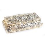 JOSEPH GLOSTER; a late Victorian hallmarked silver trinket box of rounded rectangular form, the