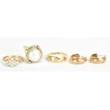 An 18ct yellow gold and three stone diamond set ring, size O, approx 2.4g, a 9ct yellow gold