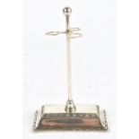 R PRINGLE; a George V hallmarked silver hatpin stand, with rectangular plinth base, Chester 1912,
