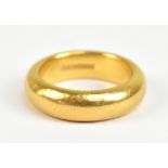 A 22ct yellow gold wedding band, size O, approx 17g.Additional InformationHeavy wear, scratches