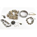 A small group of costume jewellery comprising hallmarked silver bangle and charm bracelet, approx