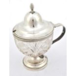 A Dutch silver mounted clear cut glass mustard with reeded detail on spreading circular foot, height