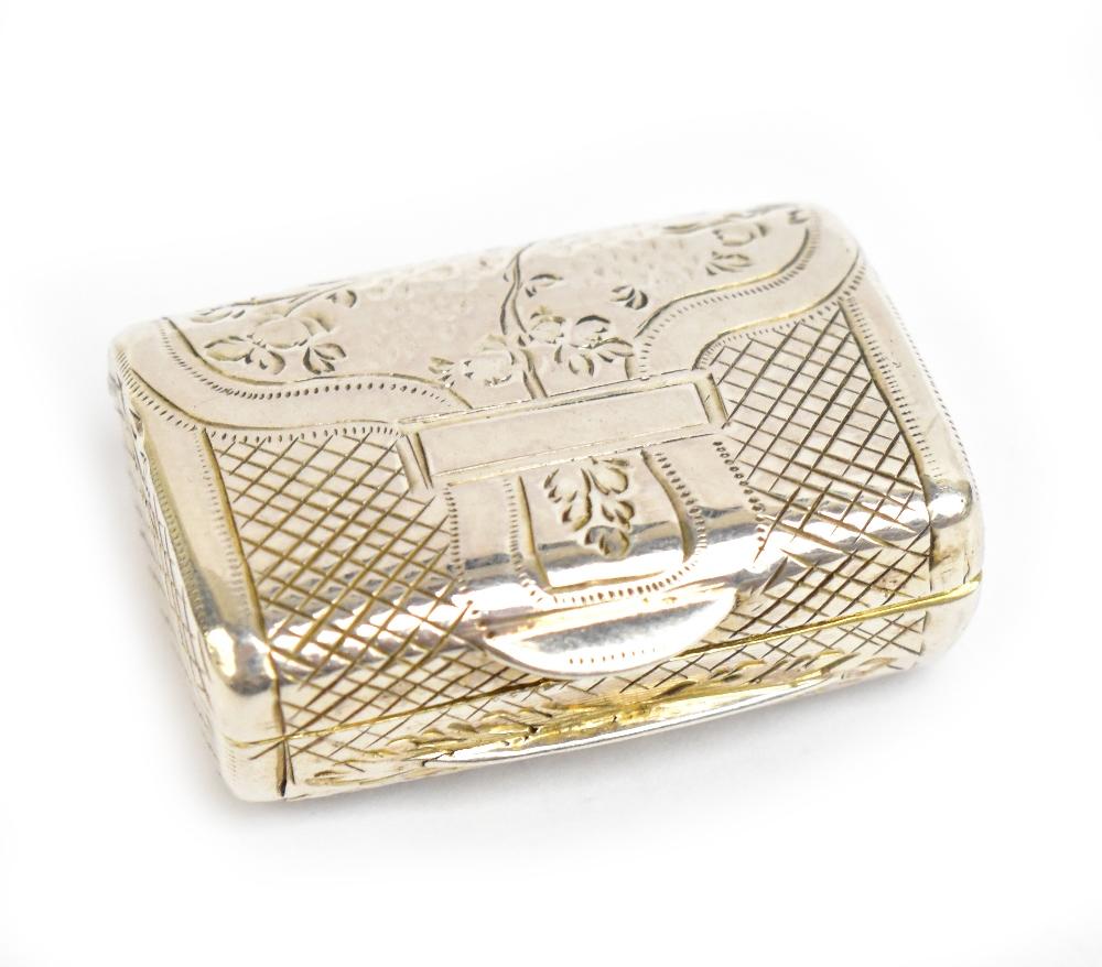 A George VI hallmarked silver vinaigrette in the form of a purse with chased detail, the hinged