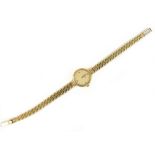 OMEGA; a lady's vintage 9ct yellow gold wristwatch, with circular dial and quartz movement, length