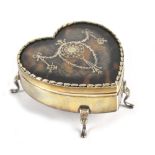 WILLIAM COMYNS; an Edwardian hallmarked silver and inlaid tortoiseshell heart shaped trinket box,