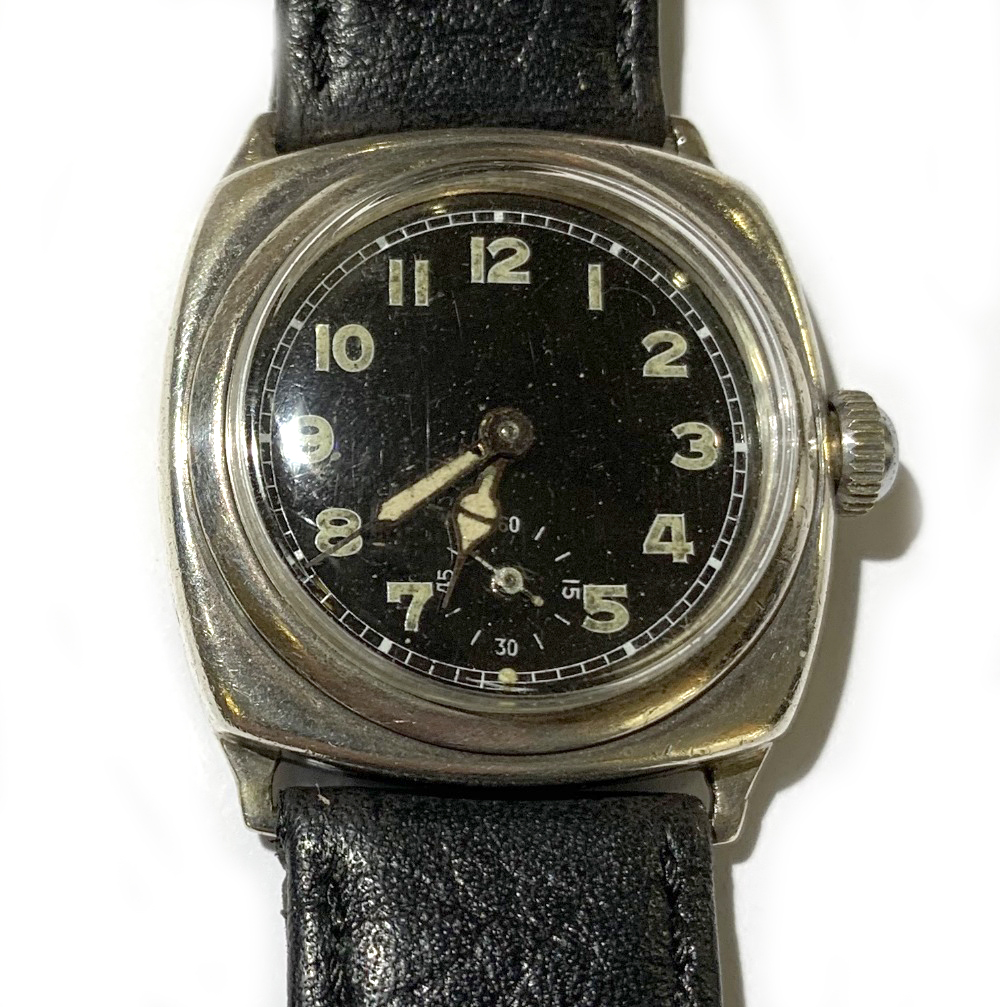 BENSON'S OF LONDON; a 1940s gentleman's silver cased military style mechanical wristwatch, the