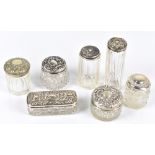 Six silver topped clear glass late 19th/early 20th century vanity jars, approx 1.4ozt/45g and an