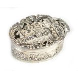 WILLIAM COMYNS; an Edwardian hallmarked silver trinket box, the pierced hinged lid decorated with