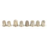 CHARLES HORNER; a group of eight hallmarked silver thimbles including examples with engine turned
