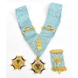 MASONIC/BUFFALO INTEREST; a pair of jewels, one in 9ct yellow gold, one in silver gilt presented
