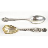 GORHAM; a American sterling silver teaspoon with a cast scrolling handle with central floral detail,
