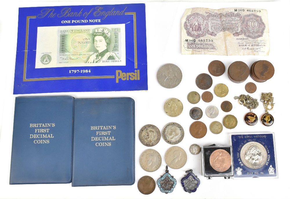 A small quantity of coins and badges including enamelled threepence and sixpence pieces on yellow